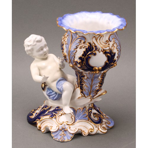 89 - A pair of 19th century Copeland figural vases, modelled as putti sitting astride a cornucopia, one h... 