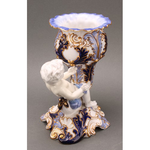 89 - A pair of 19th century Copeland figural vases, modelled as putti sitting astride a cornucopia, one h... 