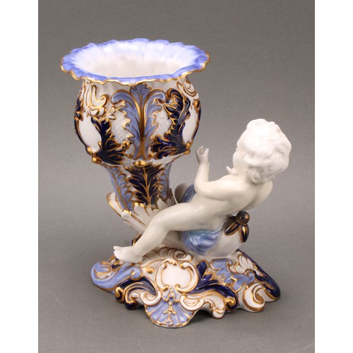 89 - A pair of 19th century Copeland figural vases, modelled as putti sitting astride a cornucopia, one h... 