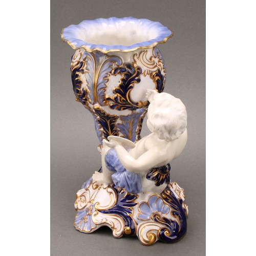 89 - A pair of 19th century Copeland figural vases, modelled as putti sitting astride a cornucopia, one h... 