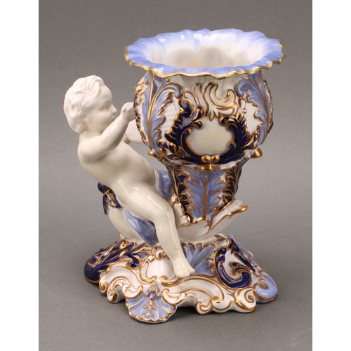 89 - A pair of 19th century Copeland figural vases, modelled as putti sitting astride a cornucopia, one h... 