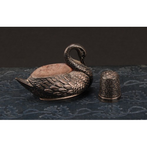 1398 - An Edwardian silver Swan pincushion,  57mm long, Adie & Lovekin Ltd, Birmingham 1908;  thimble Birmi... 