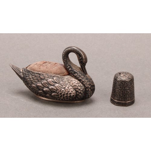 1398 - An Edwardian silver Swan pincushion,  57mm long, Adie & Lovekin Ltd, Birmingham 1908;  thimble Birmi... 