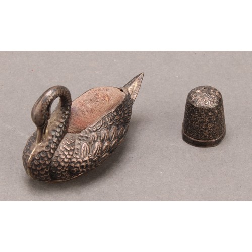 1398 - An Edwardian silver Swan pincushion,  57mm long, Adie & Lovekin Ltd, Birmingham 1908;  thimble Birmi... 