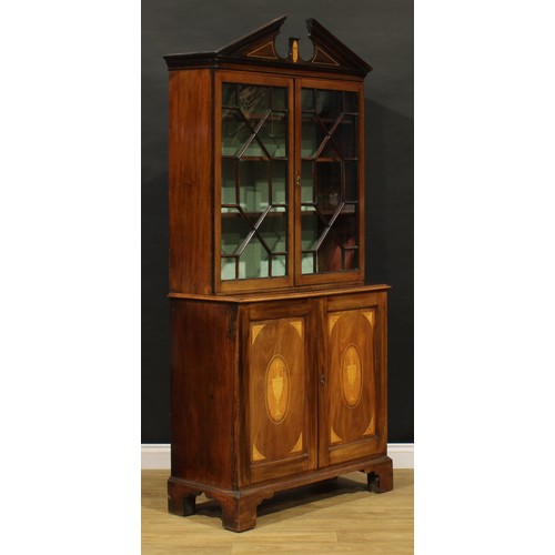 1503 - A George III mahogany and marquetry library bookcase, in the Sheraton taste, broken arch pediment wi... 