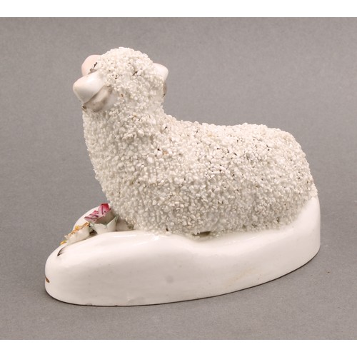 96 - A pair of early 19th century Staffordshire porcelain models, of a sheep and ram, the shaped bases ap... 