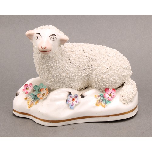 96 - A pair of early 19th century Staffordshire porcelain models, of a sheep and ram, the shaped bases ap... 