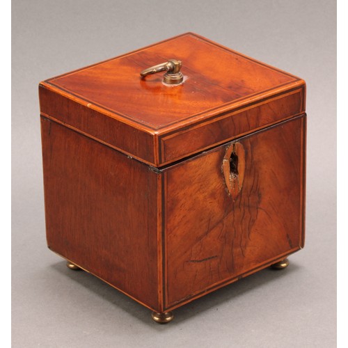 2330 - A George III mahogany domed rectangular tea caddy, hinged cover enclosing a compartmented interior, ... 