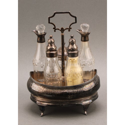 773 - A George III silver five bottle boat shaped cruet stand, central carrying handle, silver mounted cut... 