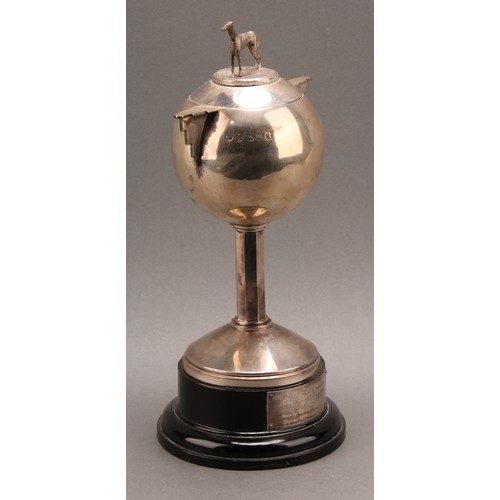 805 - A George V Art Deco silver two handled globular trophy and cover, angular handles, octagonal column,... 