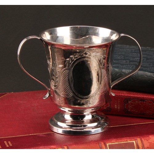 790 - A George III silver two handled cup, ridged handles, later decorated with scrolling foliate and latt... 