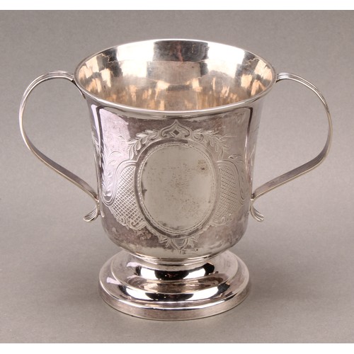 790 - A George III silver two handled cup, ridged handles, later decorated with scrolling foliate and latt... 