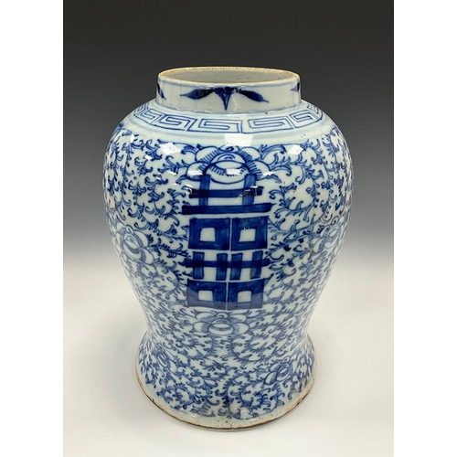 1308 - A large Chinese Qing Dynasty under-painted blue and white ginger jar, decorated with scrolling leafy... 