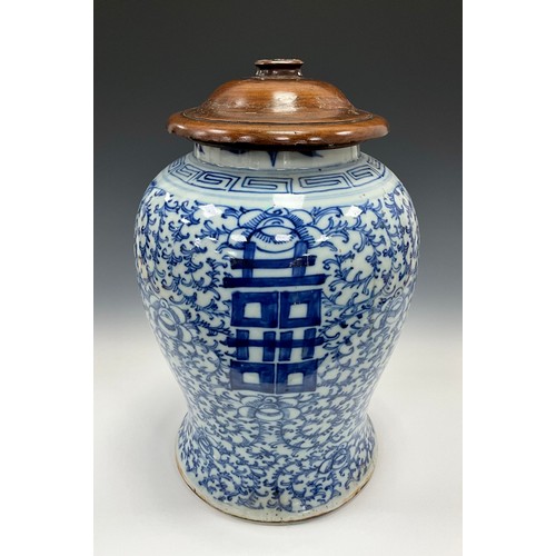 1308 - A large Chinese Qing Dynasty under-painted blue and white ginger jar, decorated with scrolling leafy... 