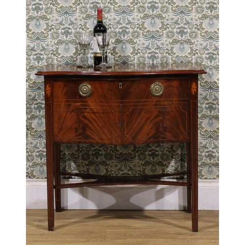 1523 - An unusual 19th century mahogany serpentine cellarette cabinet, in the Hepplewhite taste, oversailin... 