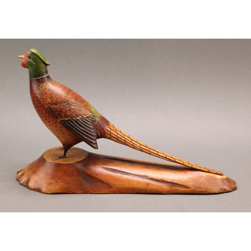 1957 - Folk Art - a polychrome decorated softwood model, carved as a pheasant, naturalistic base stamped L.... 