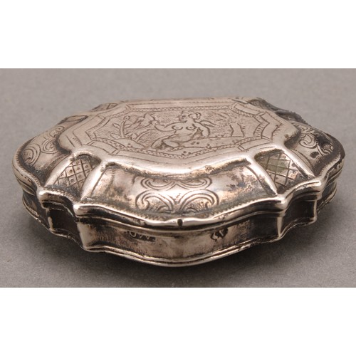 976 - An 18th century Continental silver shell shaped snuff box, hinged cover engraved with a scantily cla... 