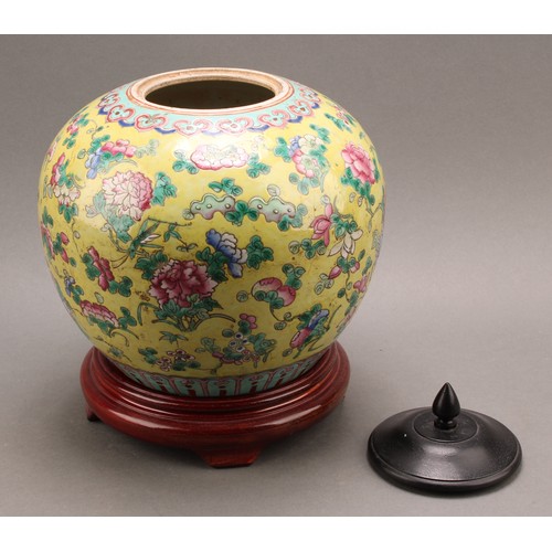 1290 - A 19th century Chinese ovoid ginger jar on stand, decorated in the famille rose tradition on a yello... 