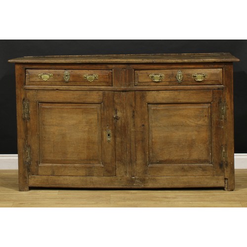 2416 - An 18th century oak dresser, moulded cornice above a pair of shelves, the projecting base with two f... 