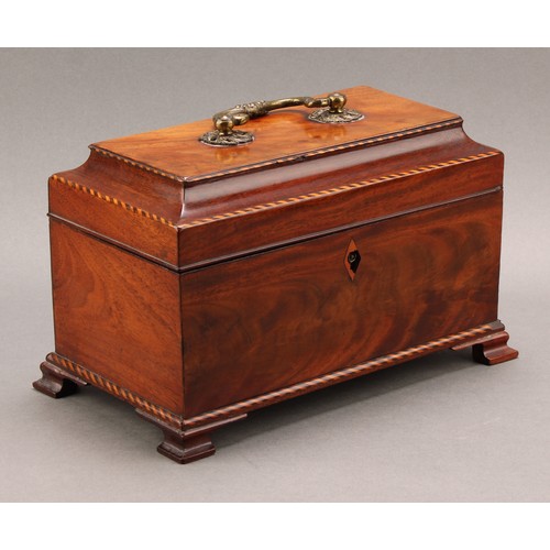 2349 - An early George III mahogany tea caddy, hinged padoda top enclosing three tin canisters, brass Rococ... 