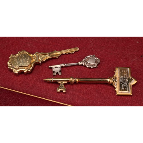 1101 - Copoclephily - Military Interest - an Elizabeth II silver-gilt presentation key, Teritorial Army, C.... 