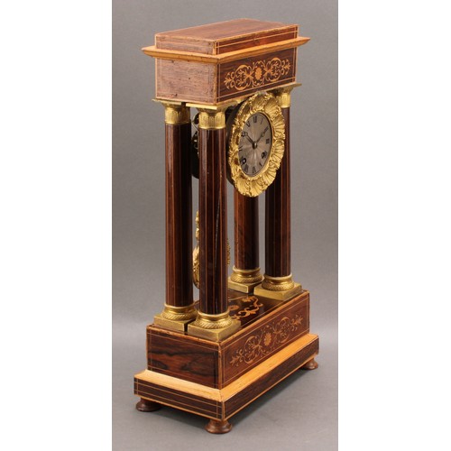 2449 - A French rosewood and marquetry inlaid portico mantel clock, the frieze supported by four stylised g... 