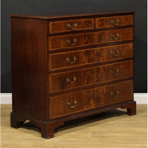 1501 - A George III flame mahogany chest, of two short and four long graduated cockbeaded drawers, outlined... 