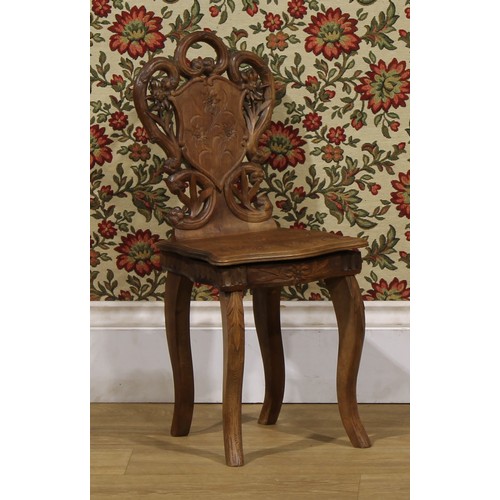 1524 - An unusual Black Forest musical child’s chair, the sprung seat enclosing a music box movement, 64.5c... 