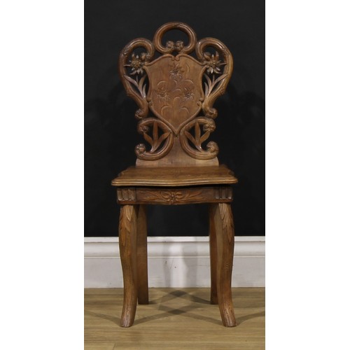 1524 - An unusual Black Forest musical child’s chair, the sprung seat enclosing a music box movement, 64.5c... 