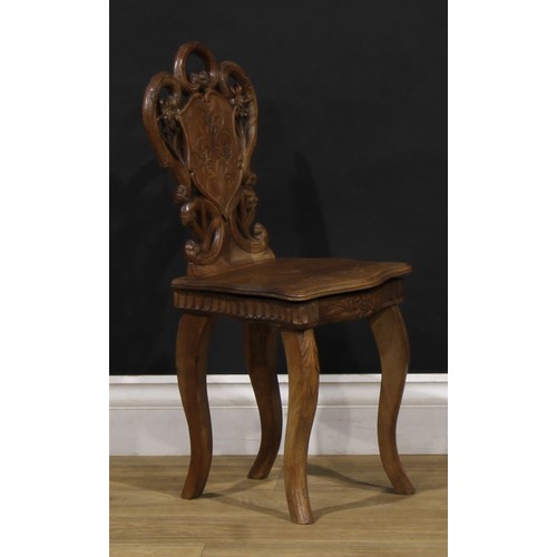 1524 - An unusual Black Forest musical child’s chair, the sprung seat enclosing a music box movement, 64.5c... 