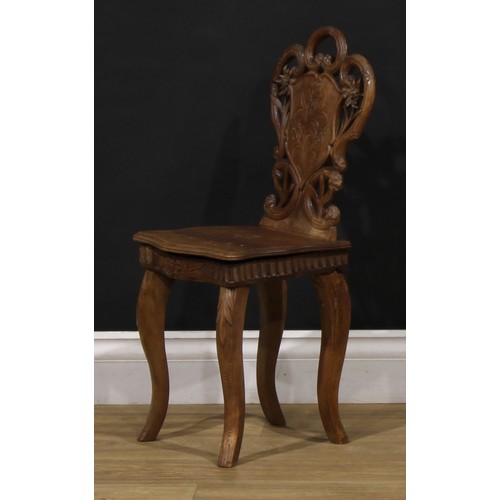 1524 - An unusual Black Forest musical child’s chair, the sprung seat enclosing a music box movement, 64.5c... 