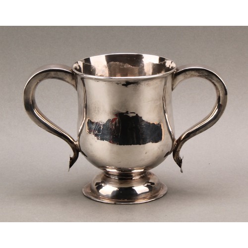 751 - A George I Britannia silver bell shaped loving cup, scroll handles with heart shaped terminals, dome... 