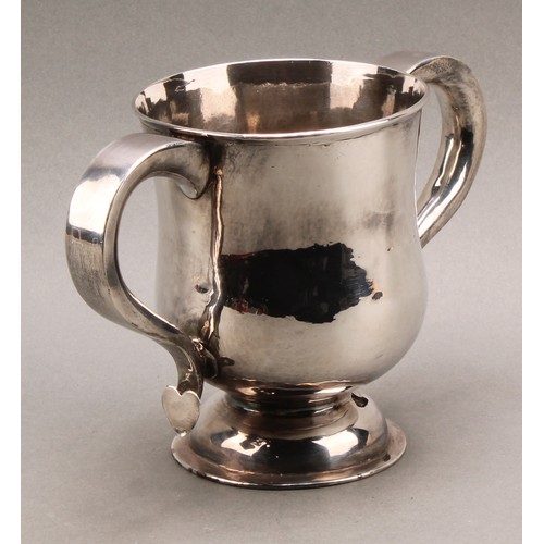 751 - A George I Britannia silver bell shaped loving cup, scroll handles with heart shaped terminals, dome... 