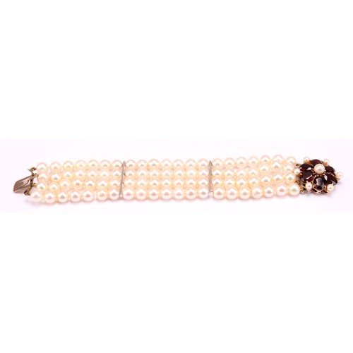 1209 - A garnet and cream cultured pearl bracelet with pink overtones, four strand with two bar dividers wi... 