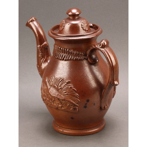 22 - A 19th century salt glazed stoneware Brampton tea pot, the cover with mushroom finial and rosette mo... 