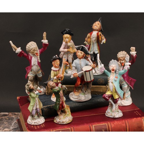 220 - A collection of Continental porcelain Monkey band models, after the Meissen originals, in animated p... 