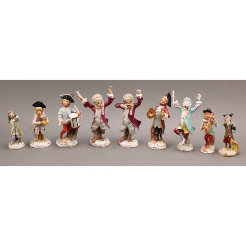 220 - A collection of Continental porcelain Monkey band models, after the Meissen originals, in animated p... 