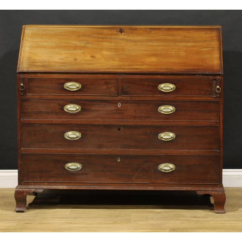 1506 - A George III mahogany bureau, fall front enclosing a fitted interior, the central door inlaid with a... 