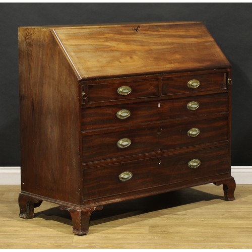 1506 - A George III mahogany bureau, fall front enclosing a fitted interior, the central door inlaid with a... 