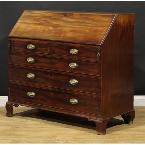 1506 - A George III mahogany bureau, fall front enclosing a fitted interior, the central door inlaid with a... 