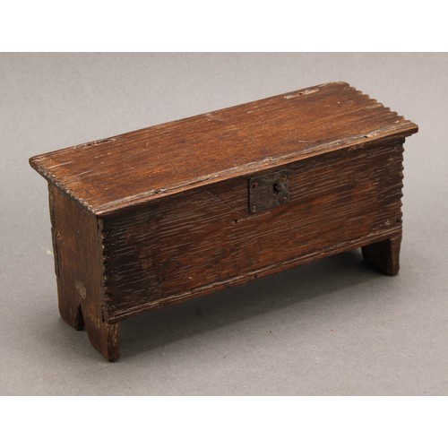 1966 - Miniature Furniture - a 17th century design oak six-plank chest, notched borders, V-shaped end suppo... 