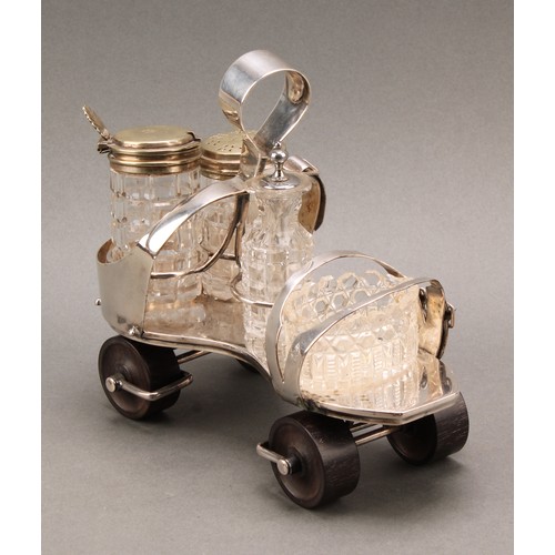 693 - A Victorian E.P.N.S novelty cruet, as a roller skate, turned rosewood wheels, 19cm long, design no. ... 