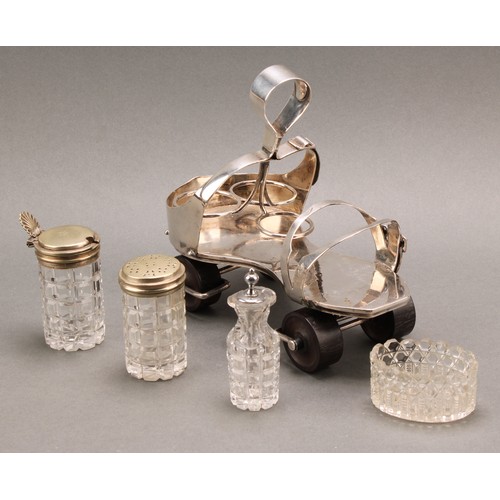 693 - A Victorian E.P.N.S novelty cruet, as a roller skate, turned rosewood wheels, 19cm long, design no. ... 