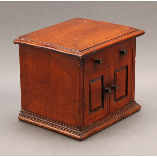 2442 - A Victorian walnut novelty tea caddy, as a miniature chest or cabinet, hinged cover enclosing a lidd... 