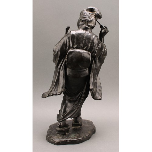 1315 - Japanese School (Meiji period), a large dark patinated bronze, of a geisha, holding a shamisen and a... 