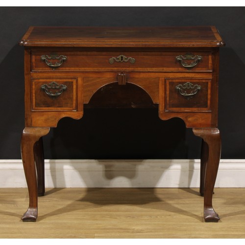 2361 - A George II red walnut lowboy, slightly oversailing crossbanded top with moulded edge and reentrant ... 