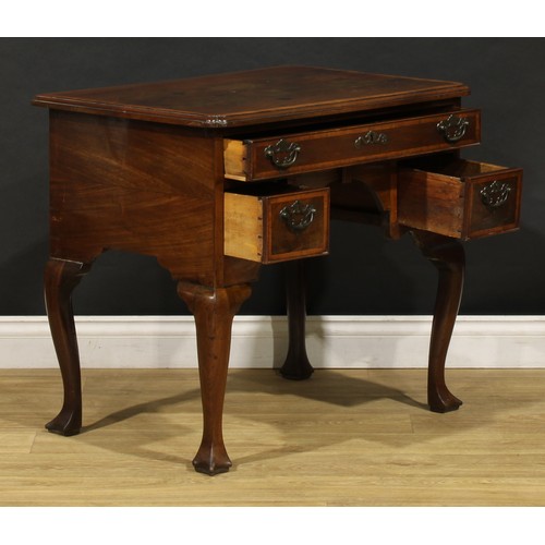 2361 - A George II red walnut lowboy, slightly oversailing crossbanded top with moulded edge and reentrant ... 