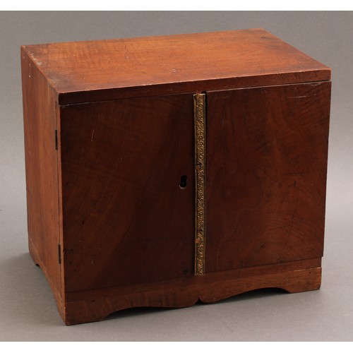 2214 - A 19th century walnut table top coin collector's cabinet, flush top above a pair of doors enclosing ... 