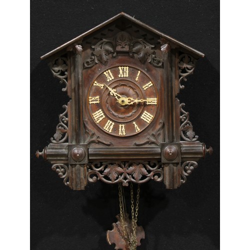 2444 - A Black Forest cuckoo clock, 14cm dial applied with Roman numerals, the architectural case pierced a... 