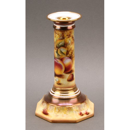 131 - A pair of Royal Worcester candlesticks, painted by Sally Wood, signed, with ripe fruit on a mossy ba... 